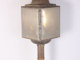 a light that is on top of a wooden pole