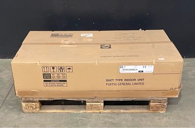 a cardboard box sitting on a pallet on the floor