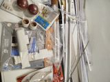 a picture of a cluttered desk with many items on it