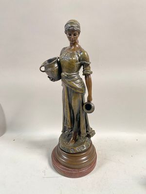 pair of antique bronze figurines of a woman holding a pitcher and a jug