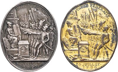 a close up of two coins with a picture of a man and a woman