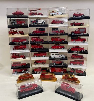 a lot of red and white model cars in display cases