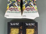 two packs of yu - gi oh trading cards are on a table