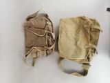 two bags that are sitting on a table
