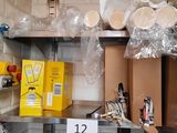 many boxes and cups on the shelves in the kitchen