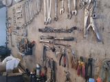 many tools hanging on the wall in the garage