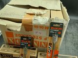 boxes of tools are stacked on top of each other on a table