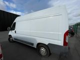 a picture of a white van parked in a parking lot
