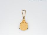 an image of a gold coin with a chain hanging from it ' s side