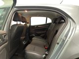 the back seats of a car with the door open and the driver ' s seat down