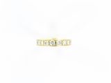 a yellow gold ring with three diamonds on a white background