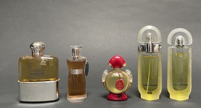 several different types of perfume bottles are lined up on a table