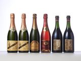 six bottles of champagne lined up in a row