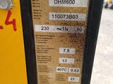 a parking meter that has a sticker on the side of it