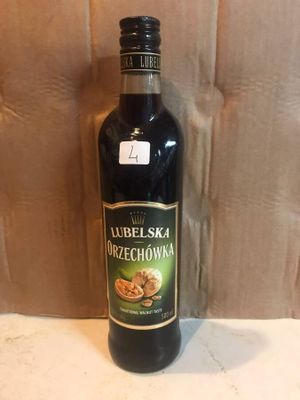 a bottle of olive oil sitting on a counter