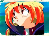 une image représentant une jeune fille de dessin animé aux cheveux roux et portant des piercings aux oreilles
