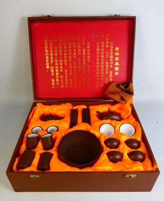 a wooden box with a set of chocolates in it