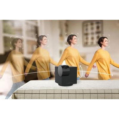 an image of a group of people standing around a bed