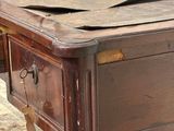 a wooden table with a drawer on top of it