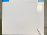 a white refrigerator with a blue tape on it