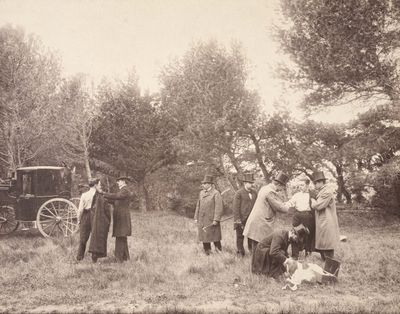 a black and white photo of a group of people standing in a field