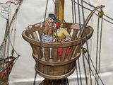 un dessin représentant un homme et une femme dans une nacelle à bord d'un bateau