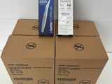 three boxes of toothbrushes are stacked on top of each other