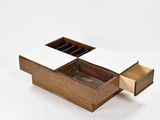 an image of a wooden box with two compartments open on a white surface