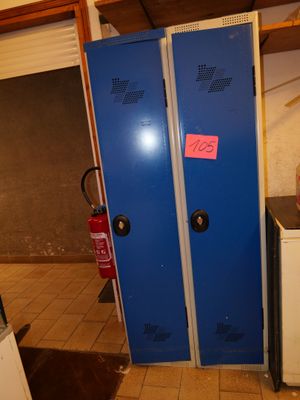two blue lockers next to each other in a room