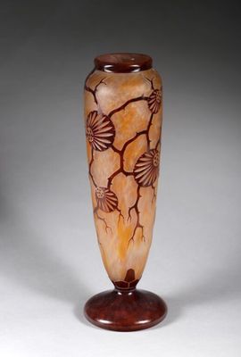 a vase that is sitting on a stand on a white surface