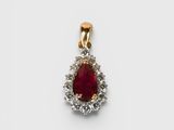 an image of a ruby and diamond pendant on a white background
