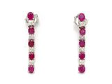 une paire de boucles d'oreilles créoles en rubis et diamants