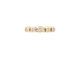 a yellow gold ring with three diamonds on top