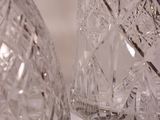 pair of clear glass vases sitting on top of a white table