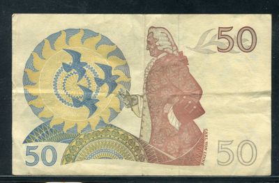 un vieux billet de banque sur lequel figure le portrait d'un homme