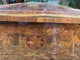 a wooden box that has a design on it