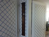 a clock on the wall in the hallway of a house