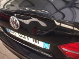 a close up of a car with a sticker on the back of it