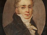 portrait of a man in a black coat with a white bow tie