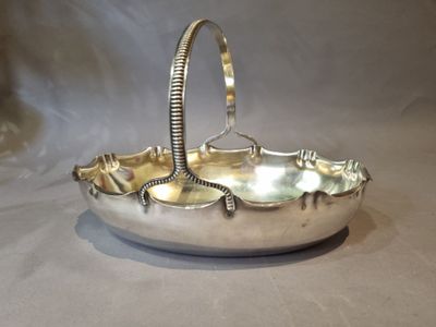 a silver plate with a handle and a handle on it