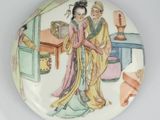 a plate with a picture of a man and woman on it