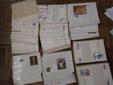 a pile of books on the floor next to a pile of envelopes