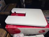 a white nintendo wii game system sitting on top of a box