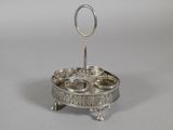an antique silver plate with three bowls on it on a stand