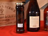 three bottles of wine sitting on a table next to a wooden box
