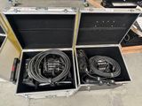 two open cases with cables in them on the floor