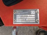 a close up of a motorcycle with a metal plate on it