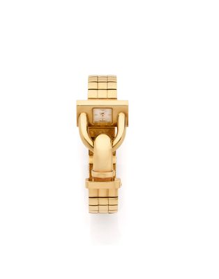 a close up of a watch on a white surface with a white background