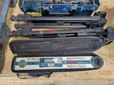 four different types of tools sitting on a table