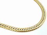 a close up of a gold necklace on a white background